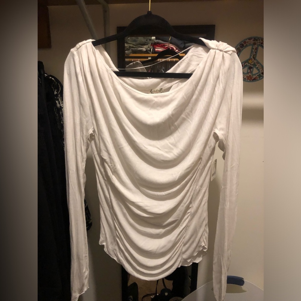Free People white slouchy long sleeve tee shirt.